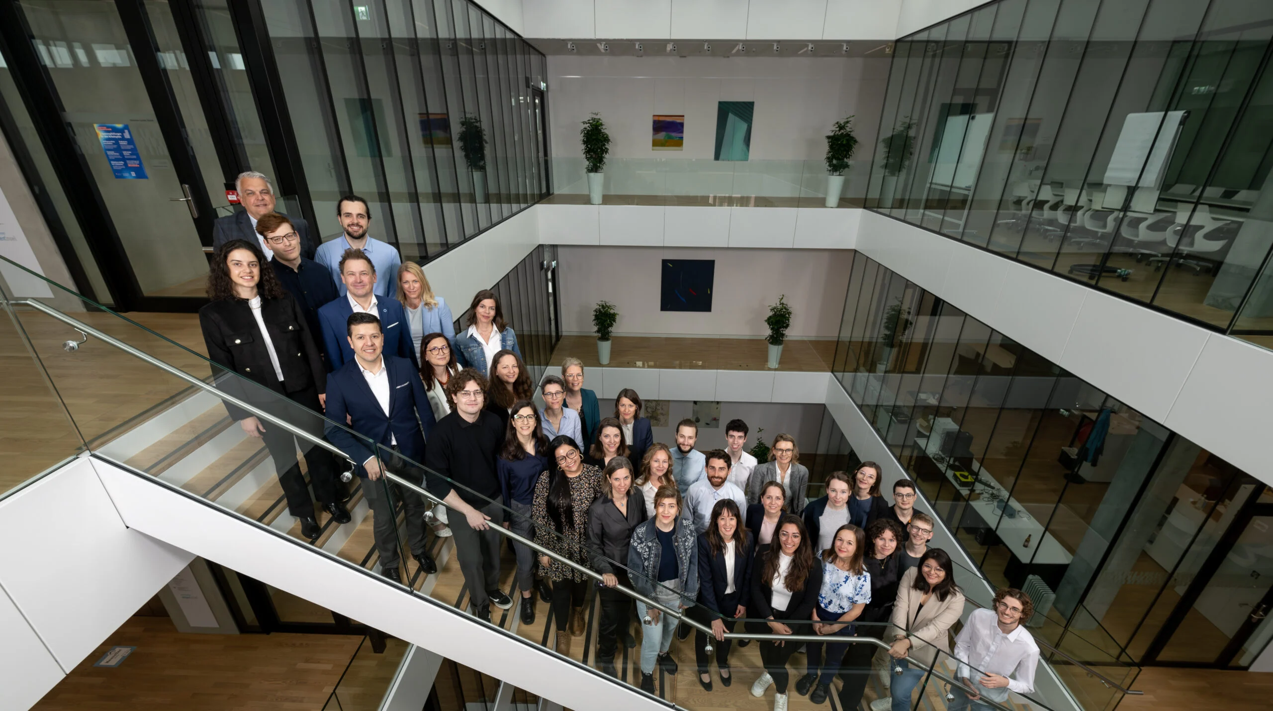 DCB Team standing on stairs